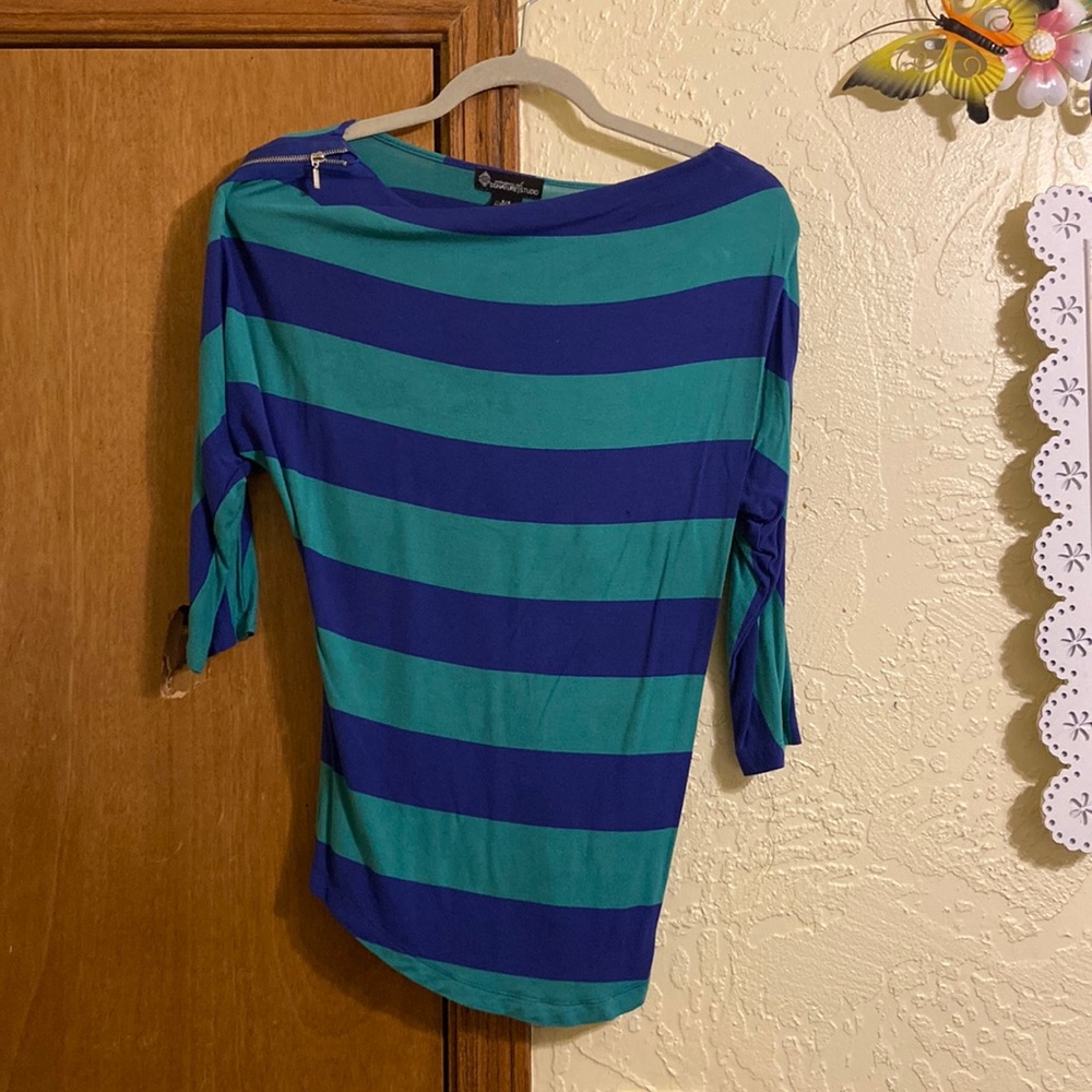 Blue and green striped shirt with a zipper on the sleeve
